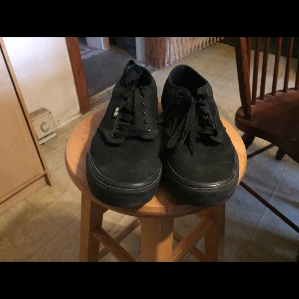 All black vans low skate shoes